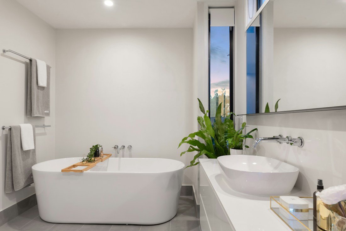Contemporary bathroom with a freestanding bath, washbasin and fittings